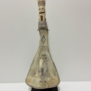 Carved Tribal Sovereign – Bone Totem Figure with Crown on Iron Stand