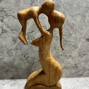 Hand-Carved Wooden Mother and Child Sculpture: Abstract Family Art