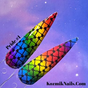 May include: Two nail art designs featuring a rainbow gradient with black hearts. The design on the left is a full rainbow gradient, while the design on the right is a rainbow gradient with a black background. The text "Pride #1" is visible in the image.