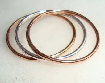 Rings -Simple stack of 3 solid gold 10k white, yellow, and rose gold bands - eco friendly solid gold from recycled sources -Minimal wedding