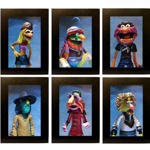 Könnte beinhalten: Sechs gerahmte Bilder von Muppet-Charakteren, jedes mit einer anderen Hintergrundfarbe. Die Charaktere sind Animal, Dr. Bunsen Honeydew, Beaker, Miss Piggy, Gonzo und Sweetums.