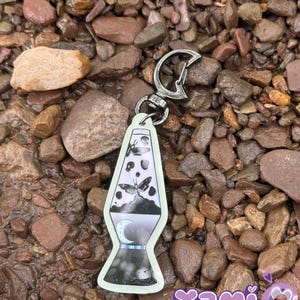 Glow in the dark Skull moth lava lamp keychain