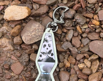 Glow in the dark Skull moth lava lamp keychain