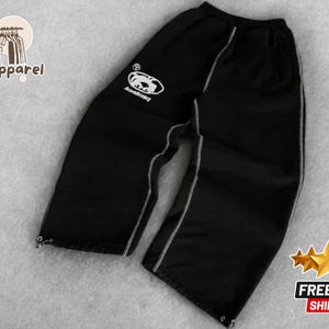 Calças de moletom largas com tema gráfico unissex | Calças de streetwear artísticas relaxadas | Calças largas retrô com patch de letras | Calça com cós elástico