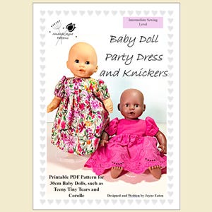 May include: A sewing pattern for a baby doll party dress and knickers. The pattern is for 30cm dolls, like Teeny Tiny Tears and Corolle. The image shows two baby dolls wearing the dresses. The text reads "Baby Doll Party Dress and Knickers".