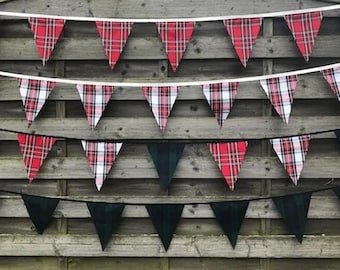 May include: Three strings of bunting with red and white plaid, black and white plaid, and green plaid triangle flags.