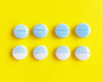 chill pill tablets, round pills shape resin studs  earrings. choose from blue, blue/white, text or no text