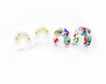 mini resin arch earrings, white with gold stars or rainbow foil studs