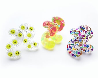 retro resin squiggle earrings. choose from smiling daisy, funky neon, or arcade