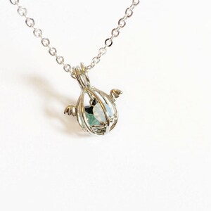 angel egg necklace with wings in silver