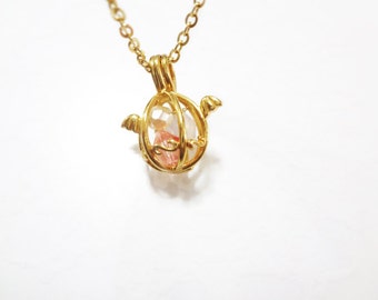 angel egg necklace with wings in gold