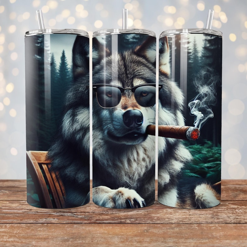 May include: A stainless steel tumbler with a wolf wearing sunglasses and smoking a cigar. The wolf is sitting in a chair in a forest setting.