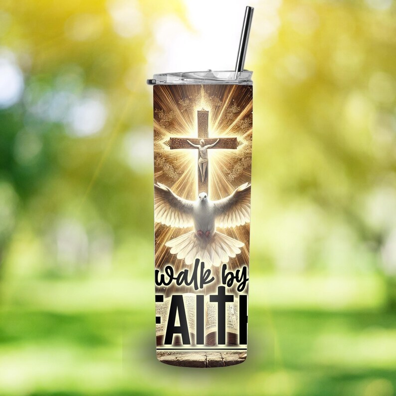 May include: A stainless steel tumbler with a religious theme. The design features a cross with a figure, a dove, and the words "walk by FAITH". The tumbler includes a silver straw and a lid.