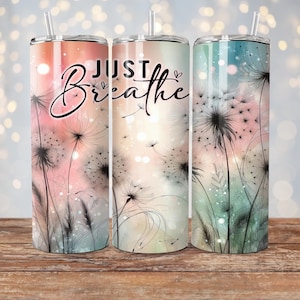 May include: Three stainless steel tumblers with straws, each featuring a different pastel color scheme and a dandelion design. The words "JUST Breathe" are written in black script across the front of the tumblers.