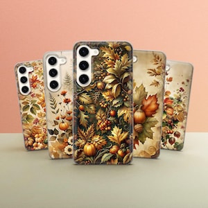 May include: Five phone cases featuring autumnal designs. The cases showcase a range of autumnal colours, including brown, orange, yellow, and green. The designs incorporate leaves, pumpkins, and other autumn-themed imagery.