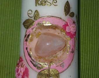 Candle decorated with rose quartz