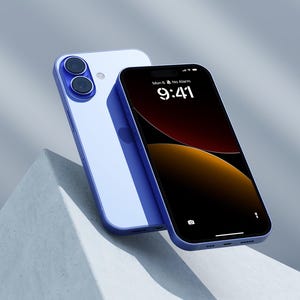 a blue and white iphone sitting on top of a cement wall