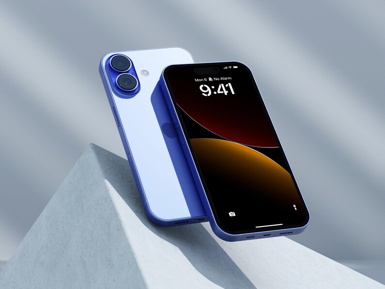 a blue and white iphone sitting on top of a cement wall