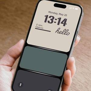 a person holding a cell phone in their hand