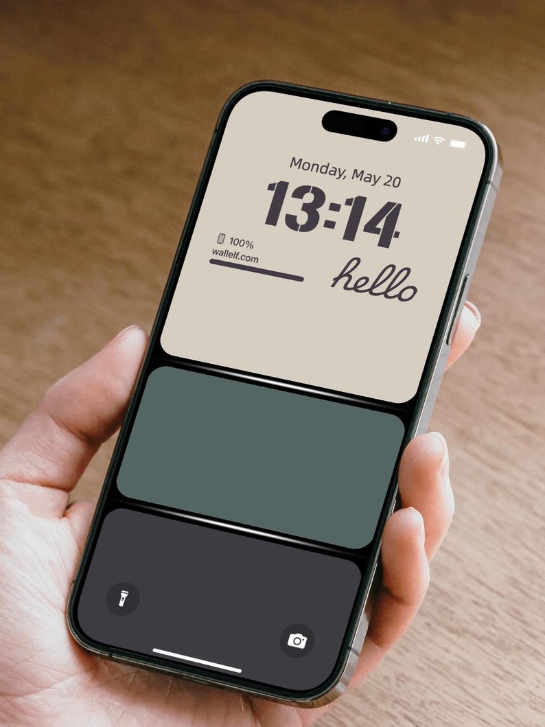 a person holding a cell phone in their hand