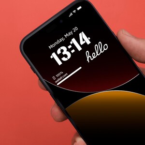 a person holding a cell phone with the time displayed