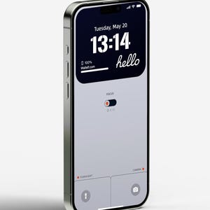 May include: A silver iPhone with a black screen displaying the time 13:14, the date Tuesday, May 20, and the word "hello". The screen also shows a battery icon with 100% charge and the text "Wallet.com". The phone has a focus toggle and icons for flashlight and camera.