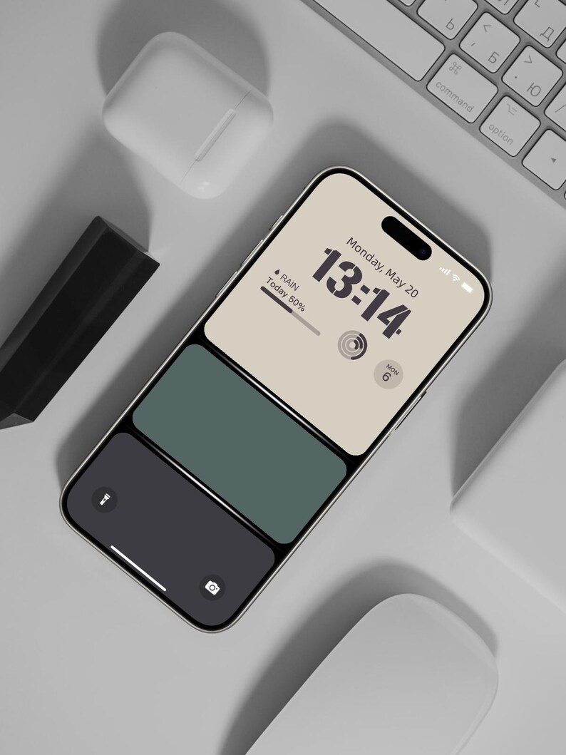 a cell phone sitting on top of a keyboard