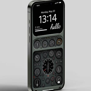 Peut inclure: Un smartphone noir avec un tableau de bord d'avion de cockpit vert et noir en arrière-plan. L'heure est 13:14 et la date est lundi 20 mai. Le texte "hello" est affiché à l'écran.