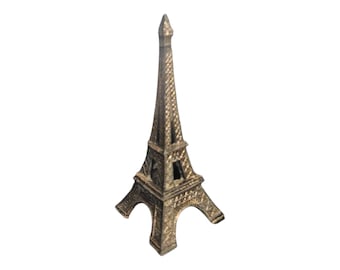 Statuetta vintage in metallo fuso raffigurante la Torre Eiffel: souvenir di viaggio a Parigi