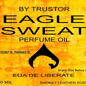 May include: A yellow and orange label with black text that reads "By Trustor Eagle Sweat Perfume Oil" and "MCT Coconut Oil, Fragrance Oil". The label also includes a black silhouette of an eagle's head and the text "Shake Well Before Use", "Eua De Liberate", "10 Mil", and "Smokey Leather Scent".