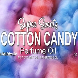 May include: A colorful image with a cotton candy theme. The text reads "Super Scents COTTON CANDY Perfume Oil." The background is a blend of pink, blue, and purple hues, resembling cotton candy. Additional text includes "Shake Well Before Use" and "10 mil."