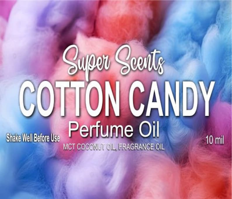 May include: A colorful image with a cotton candy theme. The text reads "Super Scents COTTON CANDY Perfume Oil." The background is a blend of pink, blue, and purple hues, resembling cotton candy. Additional text includes "Shake Well Before Use" and "10 mil."