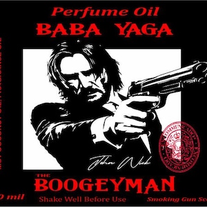 May include: A black and white illustration of a man holding a gun, with the text "Perfume Oil Baba Yaga" and "The Boogeyman" in red. The text "Smoking Gun Scent" and "10 mil" are also visible.