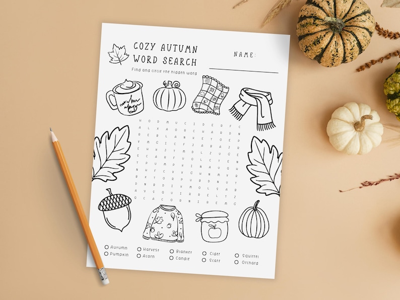 Cozy Autumn Word Search printable with pumpkins and gourds on beige background. Printable cozy autumn word search game for kids with fall-themed words like pumpkin, harvest, blanket, and cider. Fun fall classroom activity, homeschool learning worksheet, or family game night printable.