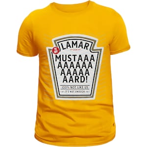 May include: Yellow t-shirt with a white graphic of a mustard bottle label that says "Lamar Mustaaa AAAAA AAAAA AARD! 100% Not Like Us It's Not Enough"