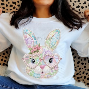 May include: A set of three ceramic mugs with a speckled, matte finish. The mugs are in shades of cream, light gray, and dark gray. Each mug has a simple, minimalist design, perfect for coffee or tea.