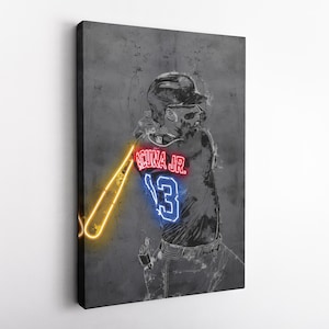 May include: A black and white illustration of a baseball player swinging a bat. The player is wearing a baseball uniform with the number "13" and the name "ACUÑA JR." in neon red and blue lettering. The background is a gray concrete wall.