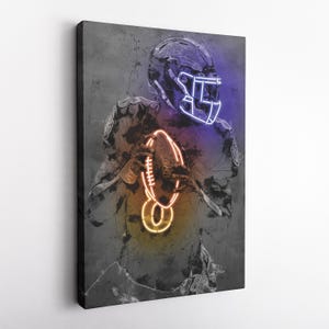 May include: A digital art print of a football player wearing a helmet with neon blue and orange accents. The player is holding a football with neon orange and blue accents. The background is a gray textured surface.
