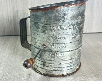 Old rusty sifter Bromwells 5 cup vintage farmhouse garden decor vignette