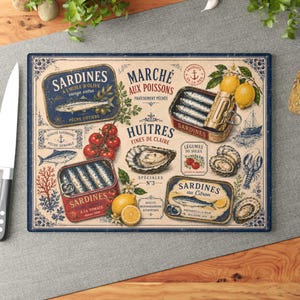 May include: Rectangular cutting board with a vintage design featuring sardines, oysters, lemons, and tomatoes. The board has a blue border and text in French, including "Sardines" and "Marché aux Poissons".