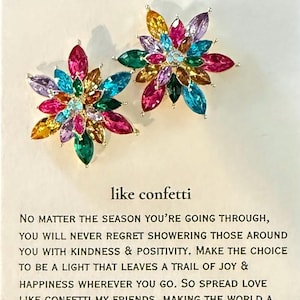 May include: A colorful inspirational quote card with a flower-shaped design made of colorful rhinestones. The quote reads "No matter the season you're going through, you will never regret showering those around you with kindness & positivity. Make the choice to be a light that leaves a trail of joy & happiness wherever you go. So spread love like confetti my friends, making the world a better place one act of kindness at a time. spread love like confetti, my friend."