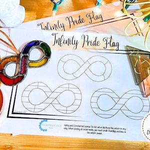 May include: A printable pattern for an infinity symbol stained glass project. The pattern features the text "Infinity Pride Flag" and includes three different infinity symbol designs. The pattern is printed on white paper and is ready to be used for crafting.