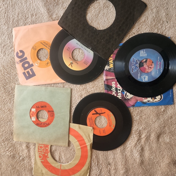 45 RPM vinyl stereo records collection Waylon Jennings Merle Haggard Mickey Gilley Glen Campbell Others
