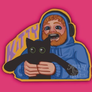 Könnte beinhalten: Eine Cartoon-Illustration einer Person mit Bart, die einen blauen Hoodie trägt und eine schwarze Katze hält. Der Text "Kitty" ist in Lila auf gelbem Hintergrund geschrieben.