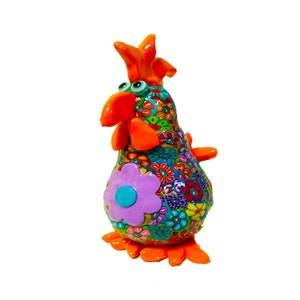 colorful handmade chicken sculpture made with polymer clay this cute chicken is decorated with small flowers that made with the Millefiori technique in the middle of the chicken there is a big purple flower - the chicken size is 5.5 inches