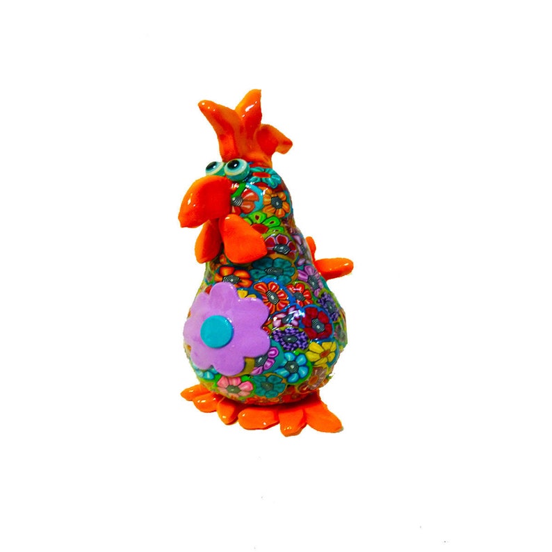 colorful handmade chicken sculpture made with polymer clay this cute chicken is decorated with small flowers that made with the Millefiori technique in the middle of the chicken there is a big purple flower - the chicken size is 5.5 inches