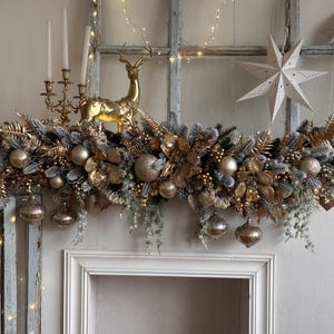 Luxury Christmas Garland in Beige and Gold with Poinsettias, Snowy Greenery, and Golden Decorations,  Elegant Mantel and Stairway Decor