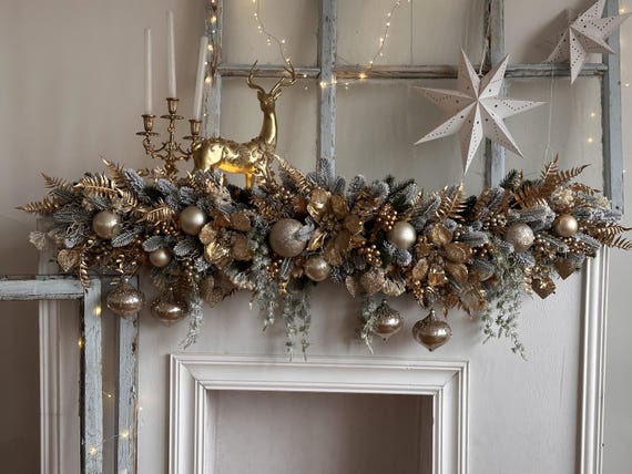 Luxury Christmas Garland in Beige and Gold with Poinsettias, Snowy Greenery, and Golden Decorations, Elegant Mantel and Stairway Decor