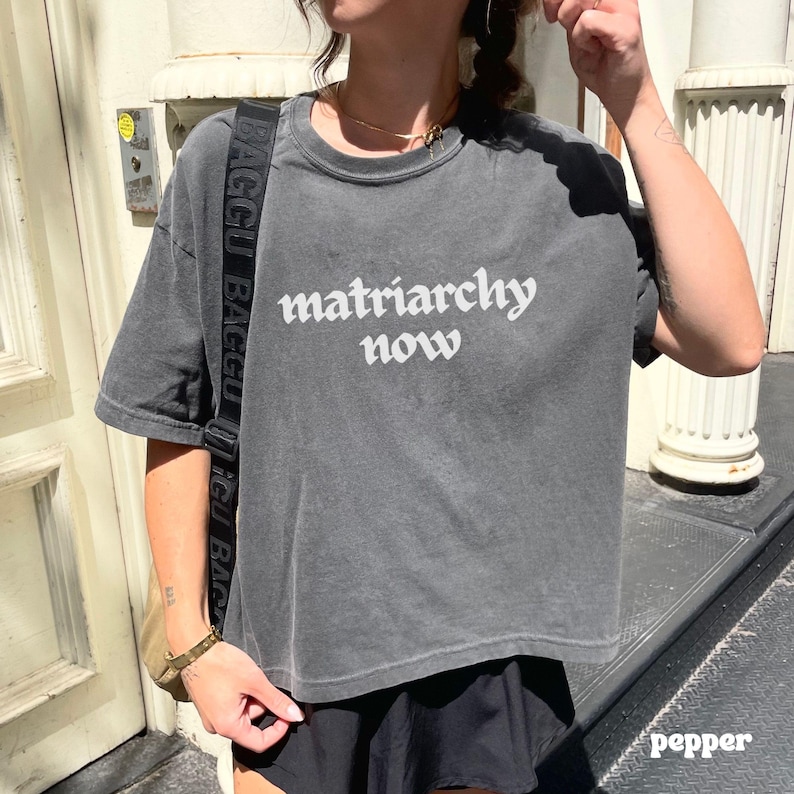 Feminist Graphic Tee Shirt Design Statement Piece Equality Message Apparel Womens Rights Movement Shirt Ring Spun Cotton Boxy Fit Vintage Look Activist Clothing Conversation Starter Protest Wear Everyday Resistance Empowering Message