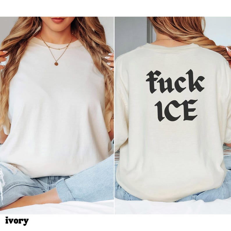 May include: Ivory-colored t-shirt with the text "fuck ICE" in black gothic font on the back. The front of the shirt is plain. The shirt is worn with blue jeans. The word "ivory" is printed at the bottom of the image.
